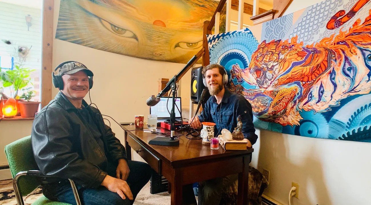 Julian and a guest recording with headphones